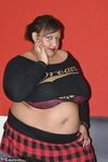SSBBBW Curvybunnyb reaches around her fat belly to pet her vagina