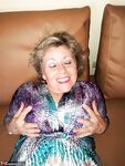 Mature woman hikes up her dress to finger fucked her moist beaver in nylons