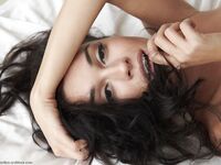Erotic brunette Karen wakes up horny and rolls on her bed spreading naked