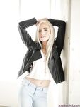 Blonde teen babe Naomi Woods pulling jeans down over ass and legs