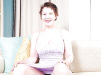 Granny model Dalny shows off her fit mature body and shaved pussy