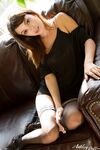 First timer Taylor Ashley exposes her nice ass as she strips to stockings