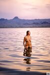 Tall natural Playboy muse Janice Raymond has fun posing nude in wild