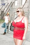 Busty blond bbw in red skirt gets caressed and kissed by a construction worker