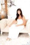Elegant MILF Lelani Tizzie takes off snow-white dress and remains in stockings
