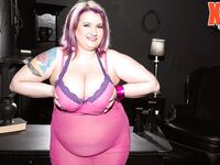 Obese female Porsche Dali releases her saggy boobs from sheer attire and bra