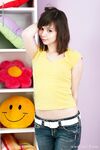 Svelte teen brunette Ariel Rebel stripping and exposing her petite body
