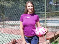 Famous brunette with nice ass Kimber Lee plays with a ball outdoors