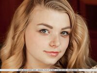 Young solo girl Daniel Sea uncovers her nice tits and shaved pussy