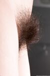 Skinny teen Baby Lizza reveals her hairy armpits and crotch in solo action