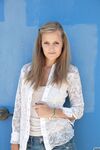 Amateur teen Jane Franklin posing in her white shirt and tight jeans outdoors