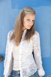 Amateur teen Jane Franklin posing in her white shirt and tight jeans outdoors