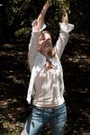Amateur teen Jane Franklin posing in her white shirt and tight jeans outdoors