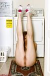 Mature redhead Phoebe Waters models naked in ankle socks on laundry day