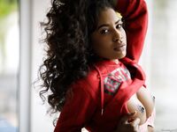 Sexy ebony teen removes ripped jeans on her way to striking great nude poses