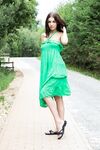 Naughty brunette Evita Lima flashes a naked upskirt then strips in the roadway
