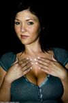 Enticing MILF Claire Dames flaunts her cleavage and inked feet fully clothed