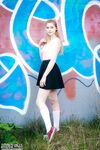 Fair skinned amateur Margarita shows her tits and twat in front of graffiti