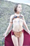 Skinny babe in Princess Leia costume Natalie rubs her clam outdoors