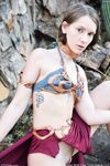 Skinny babe in Princess Leia costume Natalie rubs her clam outdoors