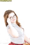 Nerdy amateur Tiffany Black shows off lace panties beneath schoolgirl skirt