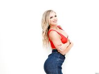 Hot blonde Alison Avery strikes great SFW poses in a denim miniskirt