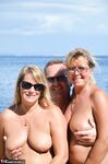 Two blonde women with saggy tits enjoy hot suck and fuck in beach threesome