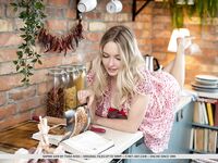 Blonde teen Sophie Gem strikes great nude poses in her kitchen
