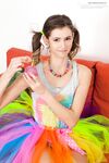 Slender teen Bea slips off her multi-colored tutu prior to finger fucking