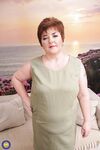 Sexy mature BBW bares her great big tits for her young boy toy to suck on