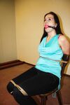 Ball gagged brunette is left all alone tied to a chair with ropes