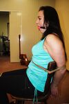 Ball gagged brunette is left all alone tied to a chair with ropes