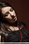 Dark haired teen Laura S masturbates her shaved pussy in stockings