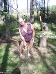 Fat granny Girdle Goddess loses her purple outfit in the woods and poses nude