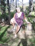Fat granny Girdle Goddess loses her purple outfit in the woods and poses nude