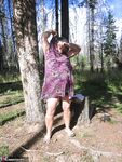 Fat granny Girdle Goddess loses her purple outfit in the woods and poses nude
