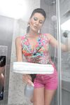 30 plus chick Olivia fingers her pussy after peeling off her clothes in shower