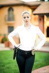 Blonde female cop strips to her black boots out on the condo walkway