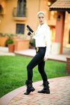 Blonde female cop strips to her black boots out on the condo walkway