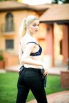 Blonde female cop strips to her black boots out on the condo walkway