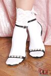 Beautiful blonde model Sophie Moone frees her bare feet from white socks