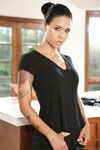 Tattooed housewife Dana Vespoli undresses in kitchen and shows her exotic body
