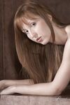 Pale redhead Baby Silver flaunts her small tits and thin body in the nude