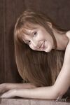 Pale redhead Baby Silver flaunts her small tits and thin body in the nude