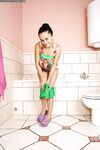Big busted brunette lassie undressing and taking foamy bath