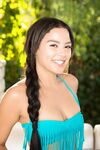 Latina babe with cute smile and braid Maya Bijou poses in the fresh air