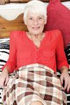 Over 70 Bristish granny takes off her clothes and lingerie striptease style