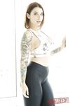 Tattooed hottie Ivy Lebelle shows her curvy body and stretches her butt