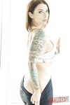 Tattooed hottie Ivy Lebelle shows her curvy body and stretches her butt