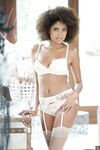 Big haired ebony Luna Corazon in white stockings gets cumshot on natural tits